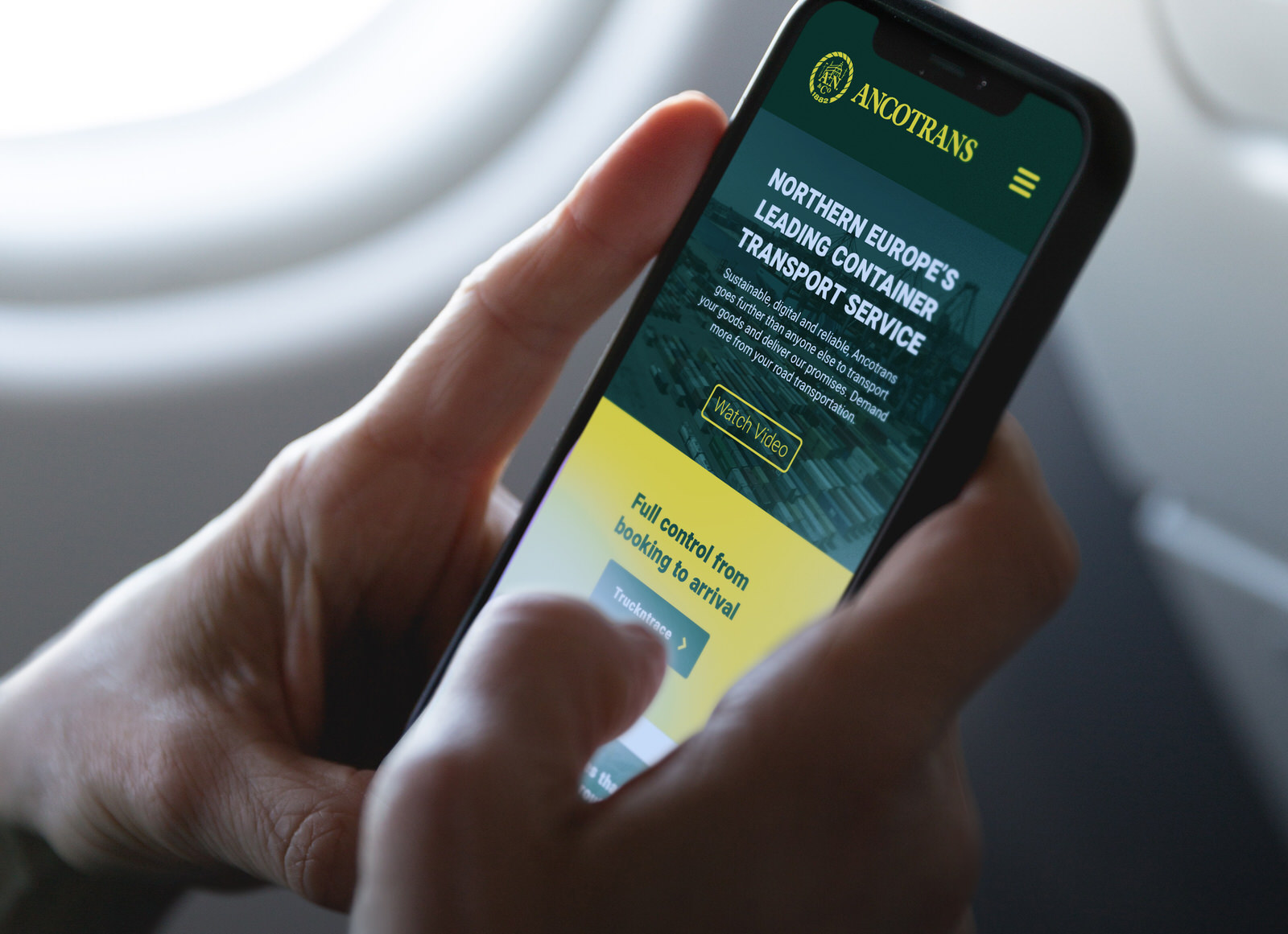 The Ancotrans website on a phone
