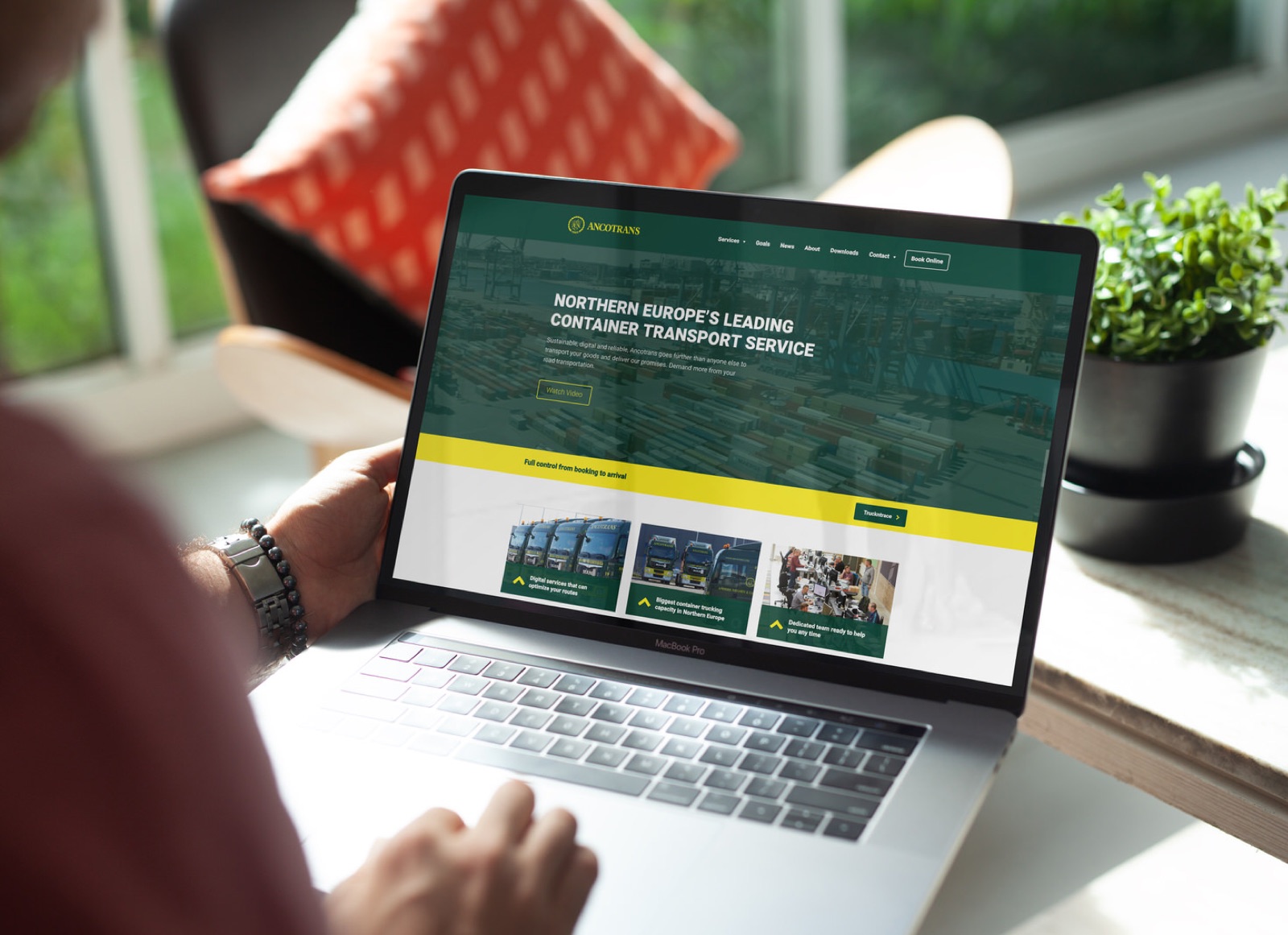 The Ancotrans website on a laptop