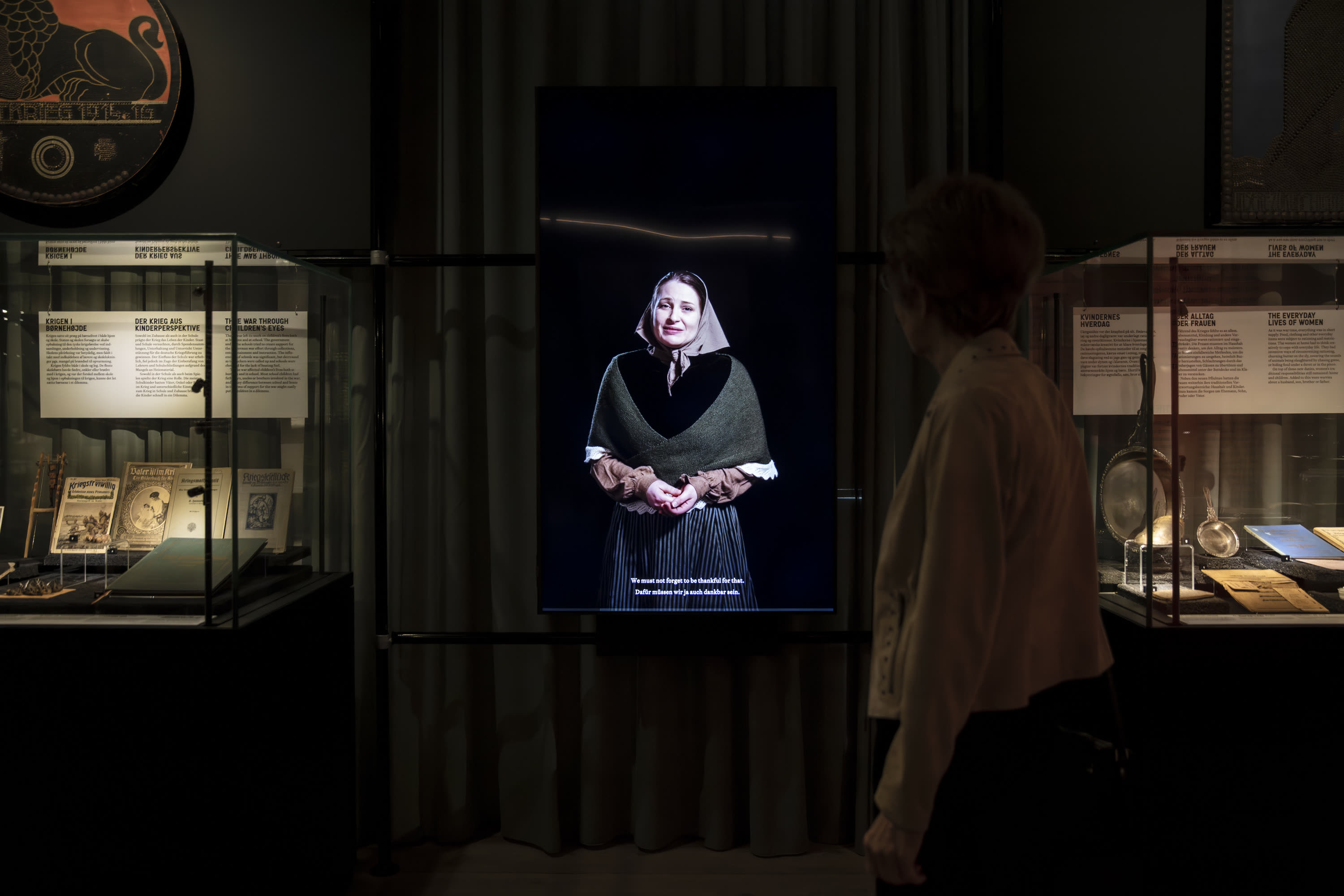 An actor on one of the life-size screens