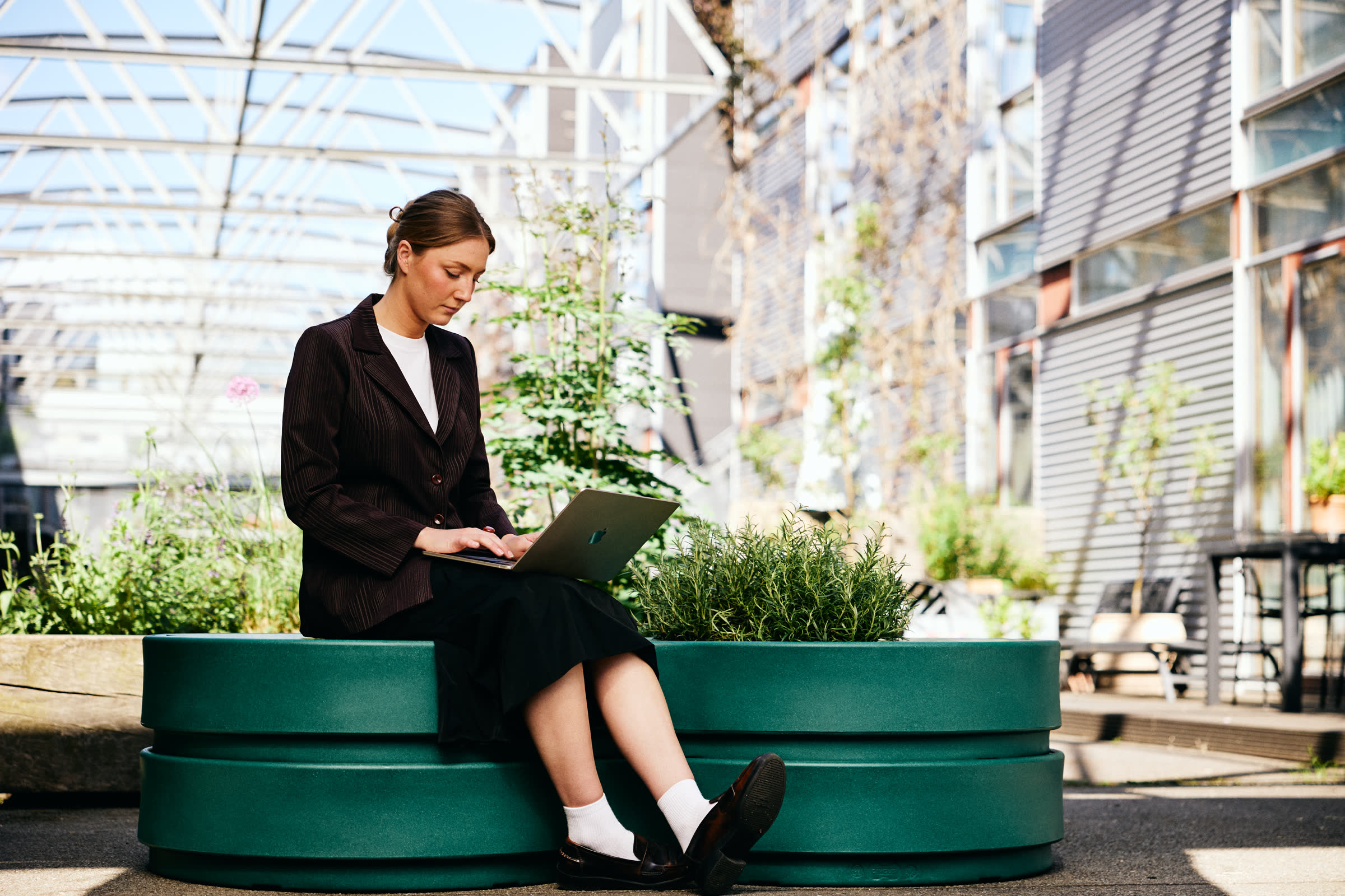A woman working on a green Circus module