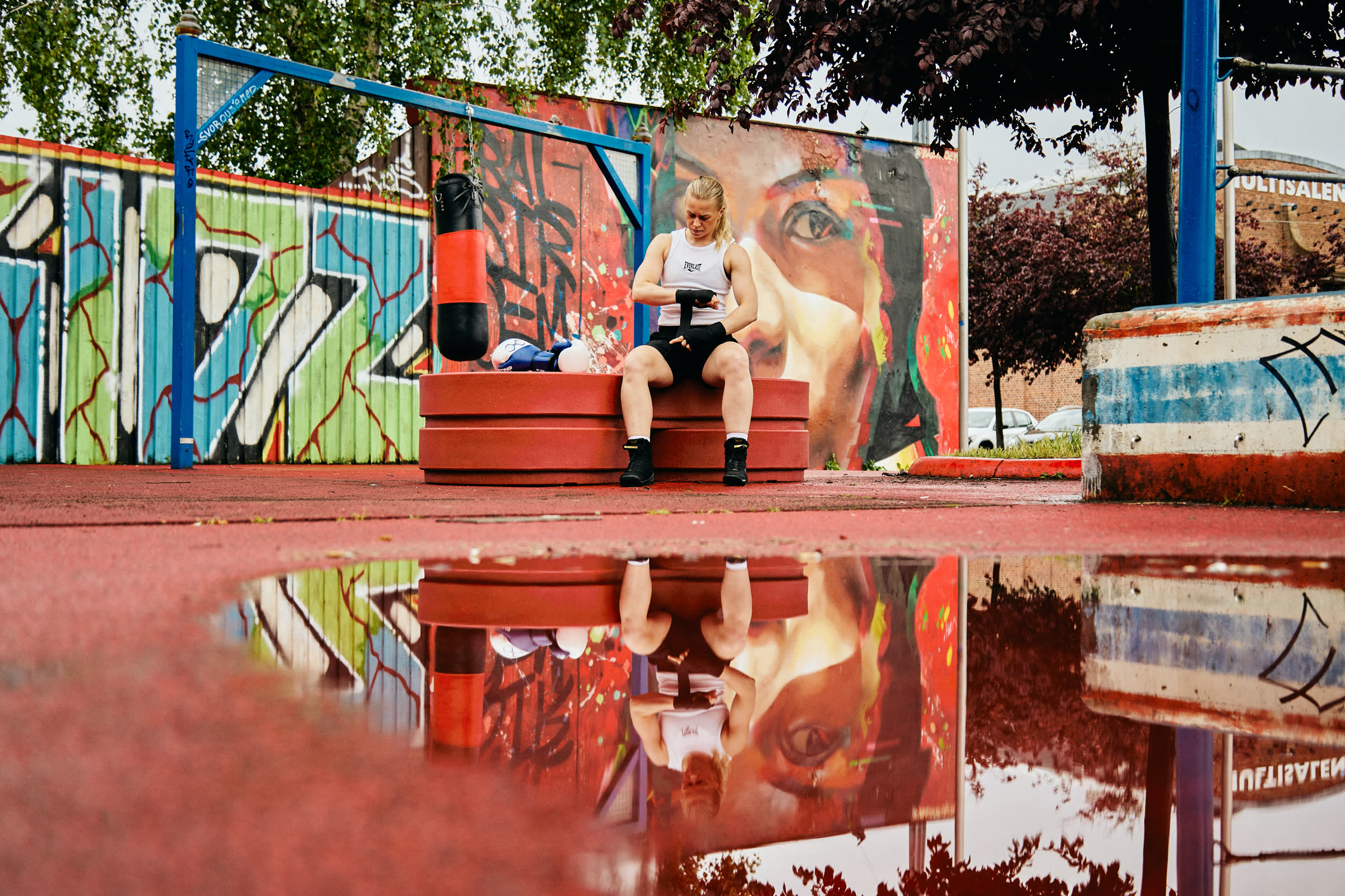 Red Circus modules by a graffiti wall