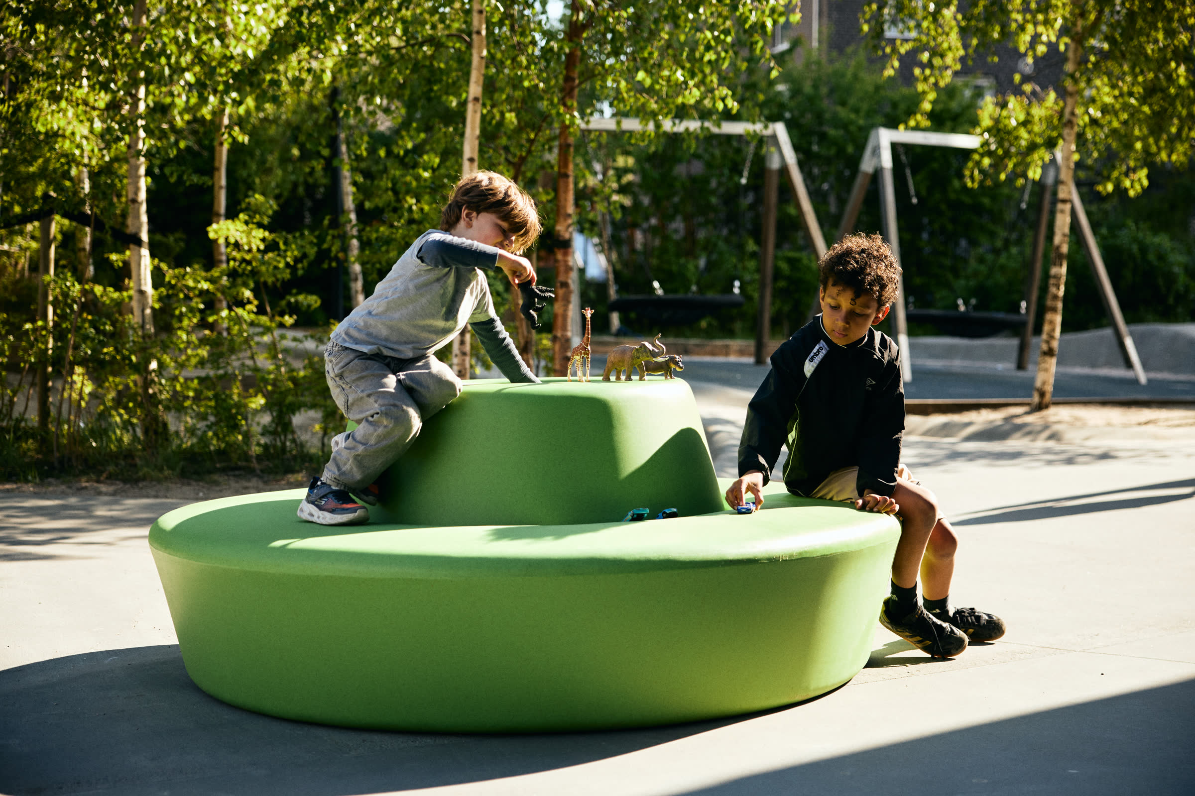 Children on a green LOOP circle