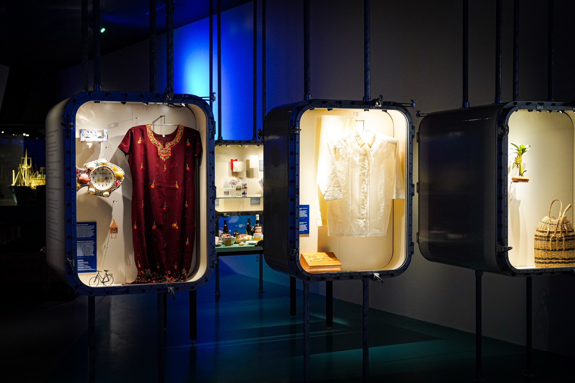 Display cases shaped like containers hanging from the ceiling