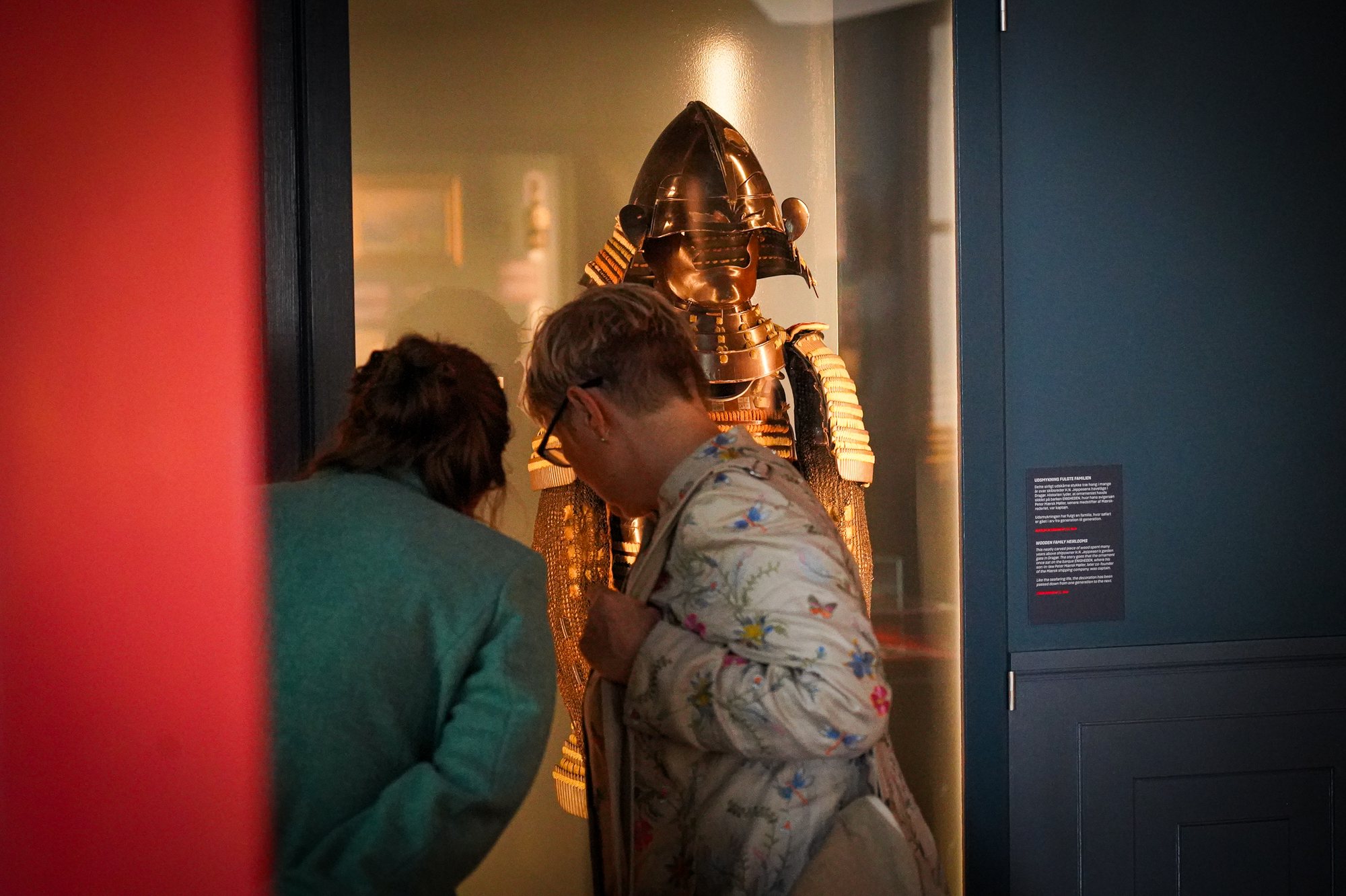 Guests studying a suit of Japanese armour