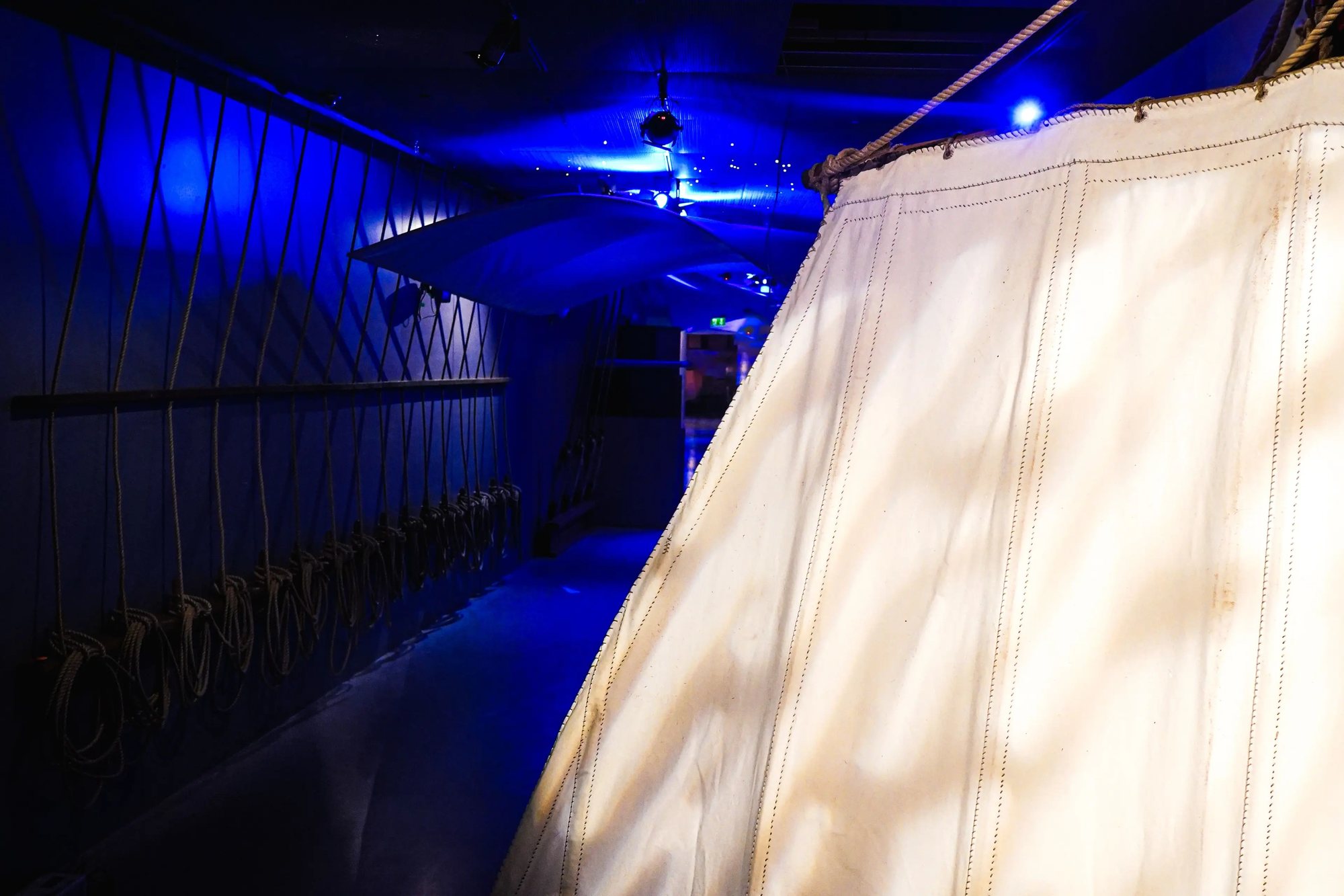 A sail lit up in the blue passage
